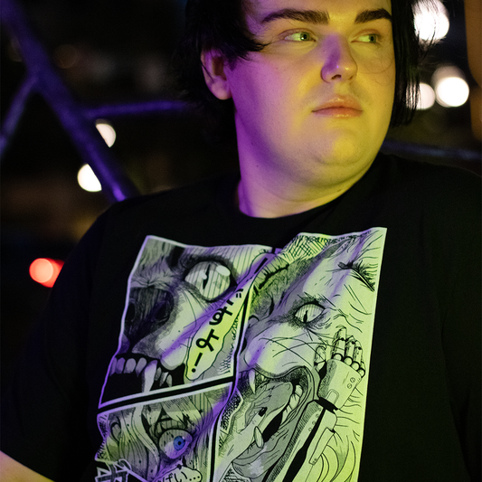 person sitting on bench, wearing black shirt with 4 panel manga style illustration with japanese text and Therdune logo