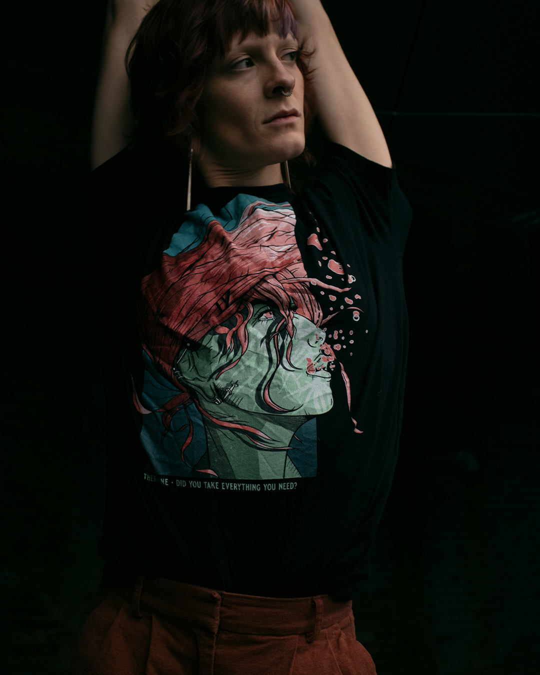 Person wearing a black shirt with a green-skinned woman with pink hair flowing underwater. Pink air bubbles. The phrase "therdune - did you take everything you need?" written on bottom