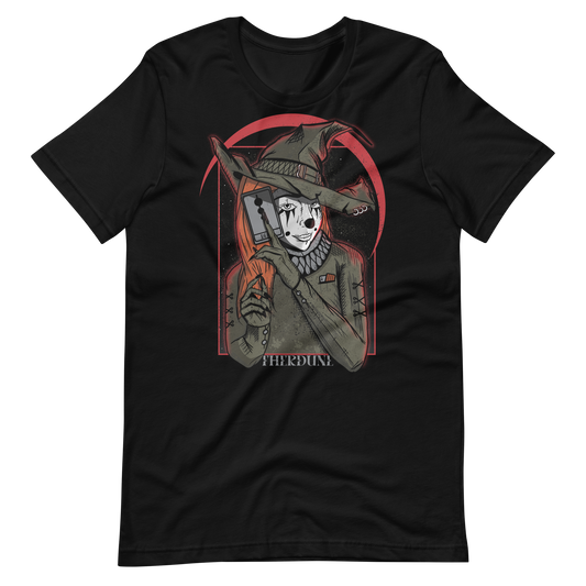 Black shirt with a graphic of a witch in clown makeup, holding a tarot card in front of a red crescent moon. "Therdune" logo on bottom of graphic.