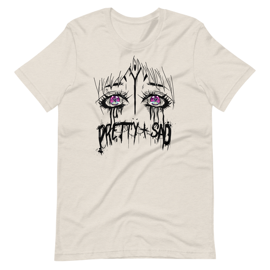 A white t-shirt with a graphic print of stylized eyes and the text 'Pretty & Sad' on the front.
