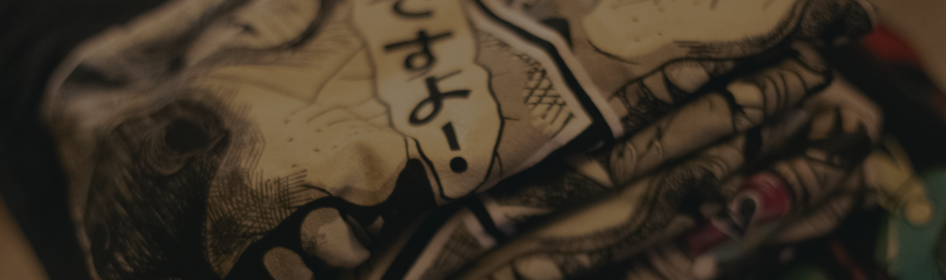 Close-up of a stack of shirts with various graphics